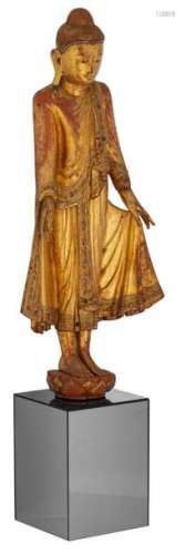 An Oriental gilt decorated wooden standing Buddha …