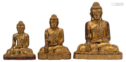 Three Oriental gilt decorated wooden figures, depi…