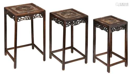 A set of three Chinese hardwood occasional tables,…