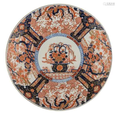 A large Japanese Arita Imari plate, the centre dec…