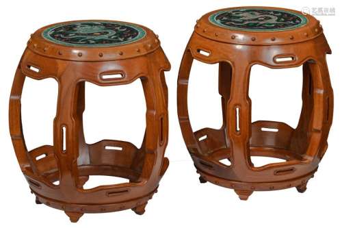 A pair of Chinese hardwood carved stools with fami…