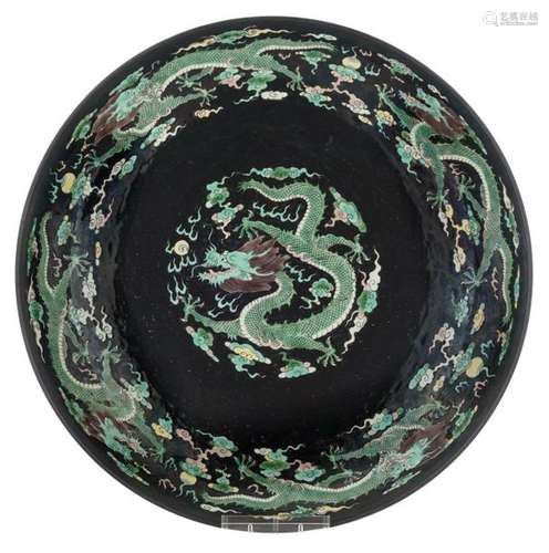 A Chinese black ground and famille verte dish, bot…