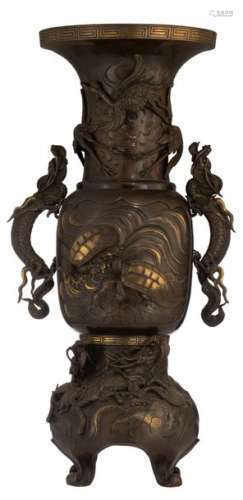 An Oriental bronze vase, relief decorated with dra…