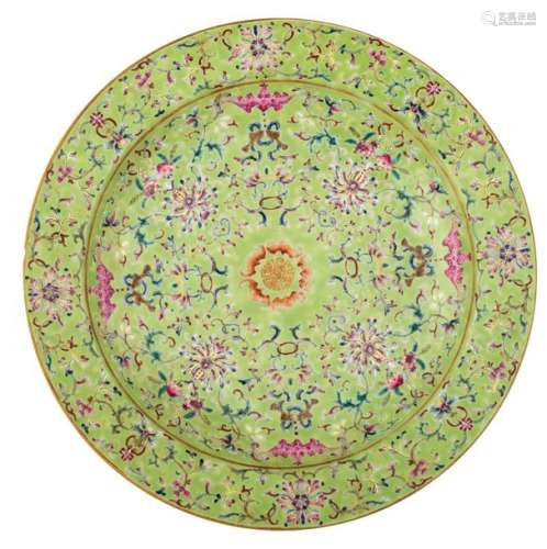 A Chinese lime green ground and famille rose plate…
