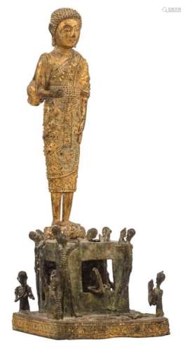 A South East Asian gilt bronze standing Buddha, on…