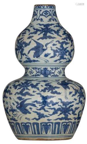 A Chinese blue and white double gourd vase, decora…