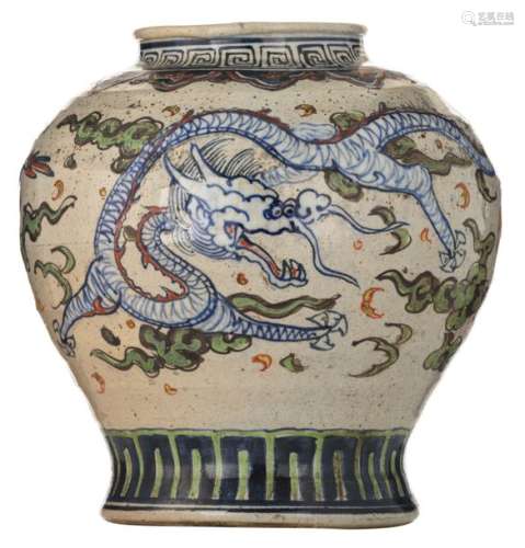An Oriental polychrome stoneware vase, decorated w…
