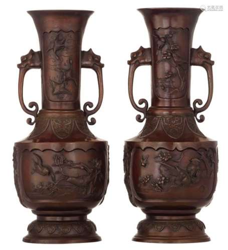 Two Oriental bronze vases, relief decorated with b…