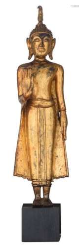 An Oriental gilt decorated bronze figure, depictin…