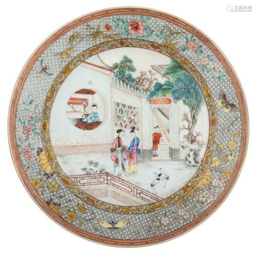 A large Chinese plate, decorated with a romantic g…