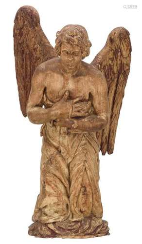 A limewood sculpture of a kneeling angel, with tra…