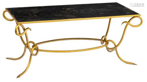 A gilt wrought iron coffee table with a mirrored t…