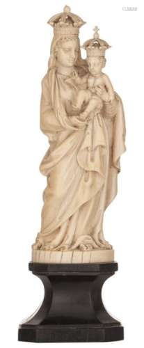 A finely carved ivory sculpture of the Holy Mother…