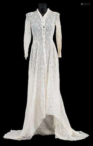 A Bruges wedding dress with floral motifs in bobbi…