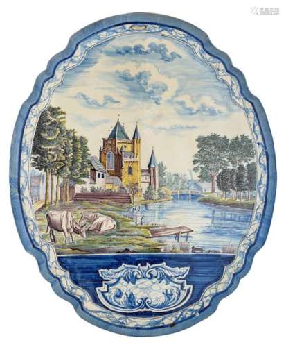 A large blue and white and polychrome hand painted…