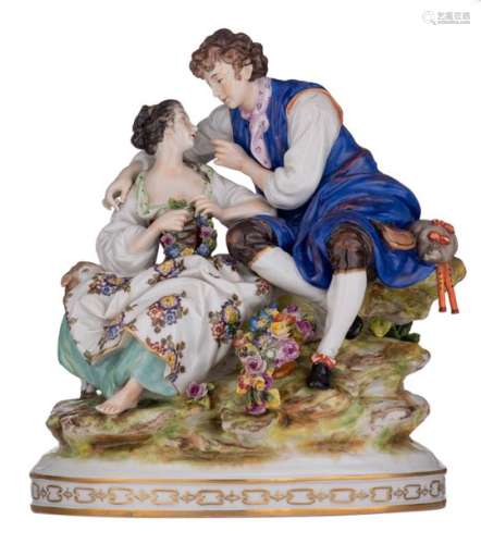 A polychrome painted porcelain group depicting a g…