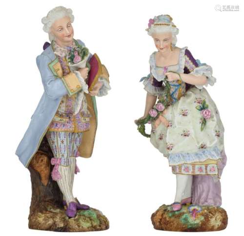 A pair of cold painted biscuit sculptures of a mar…