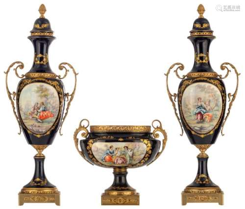 A three piece bleu royale ground garniture set in …