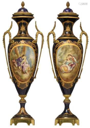 A pair of covered Sèvres type vases, bleu royale g…