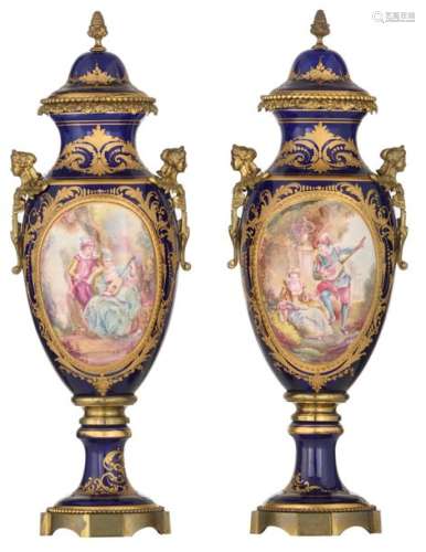 A pair of covered bleu royale ground vases in the …