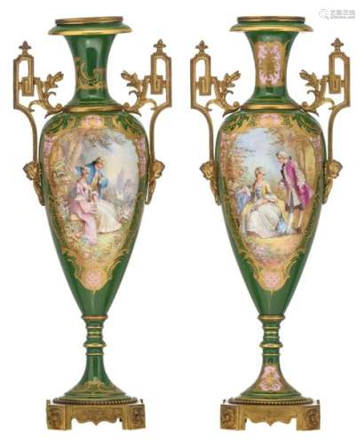 A pair of Sèvres type vases, green ground and the …