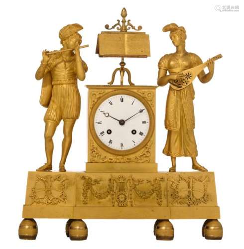 A fine ormolu mantle clock, decorated with musicia…
