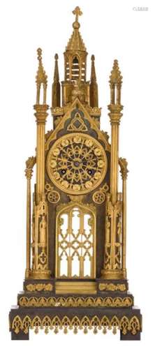 A Gothic Revival gilt bronze pendulum clock, shape…