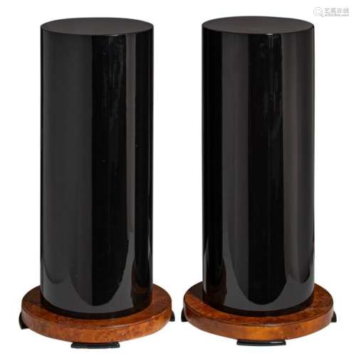 A decorative pair of black lacquered columns on a …
