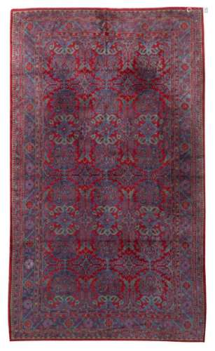 An Oriental geometric and floral decorated woollen…