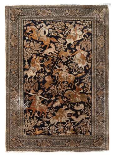 An Oriental woollen rug decorated with hunting sce…