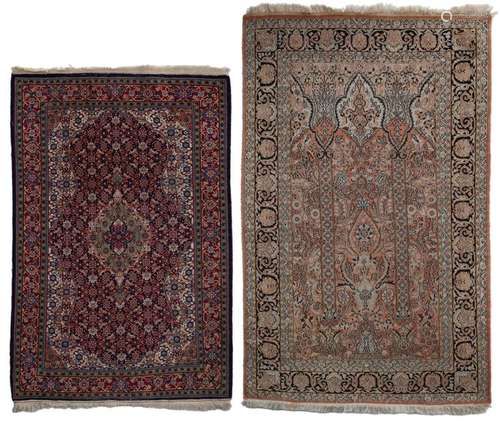 Two Oriental woollen rugs decorated with geometric…