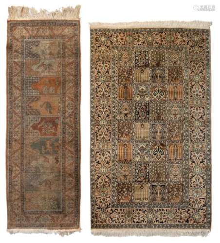 An Oriental woollen and silk rug with floral decor…