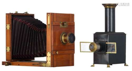 A mahogany folding camera, the lens marked 'Hermag…