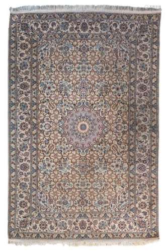 An Oriental woollen rug decorated with floral moti…