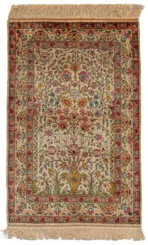 A Hereke silk rug, decorated with a flower vase, 1…