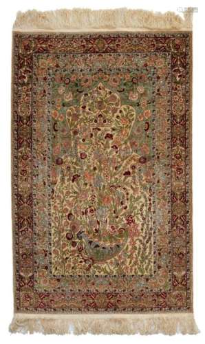 An Oriental Hereke rug with silk and gold thread, …