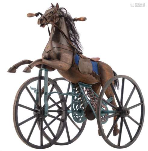 A wooden polychrome painted tricycle toy horse, th…