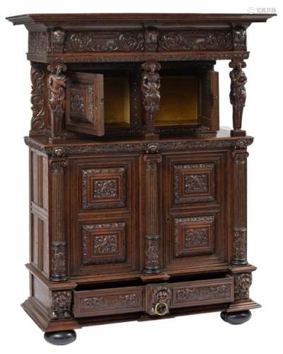 An oak cupboard, called 'kapiteelkast', richly car…