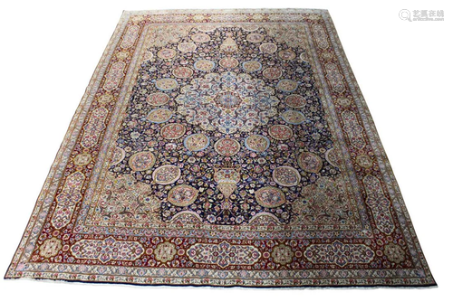 A Persian Kerman carpet