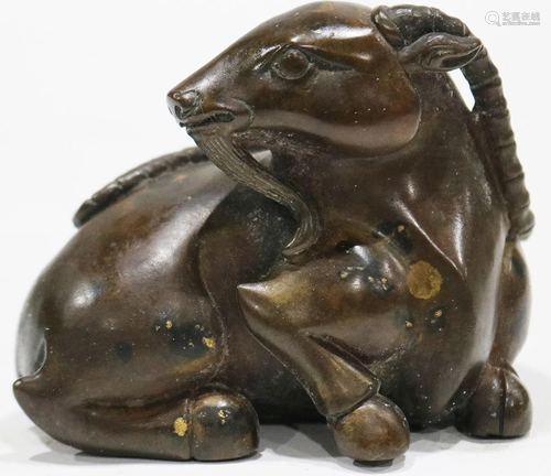 A carved Chinese bronze recumbent ram