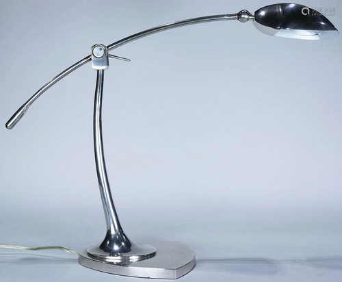 A Machine Age adjustable desk lamp hav…