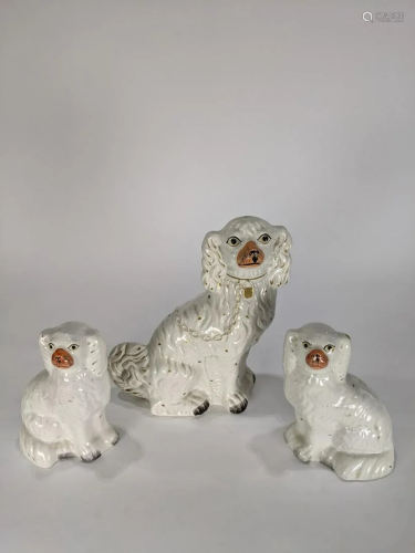 A group of Staffordshire spaniel figures