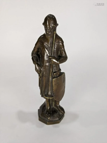 A Medieval style patinated bronze sculpture