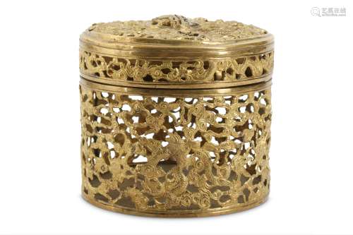 A CHINESE GILT-BRONZE RETICULATED 'MYTHICAL BEASTS' BOX AND COVER.