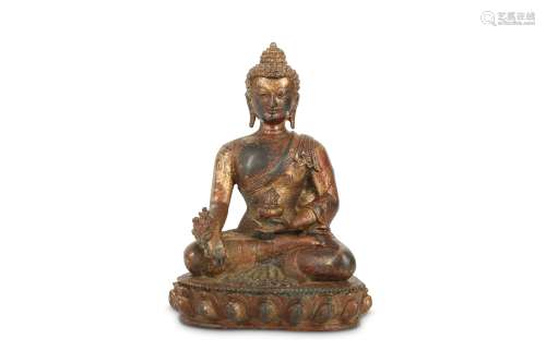 A CHINESE GILT-BRONZE MEDICINE BUDDHA.