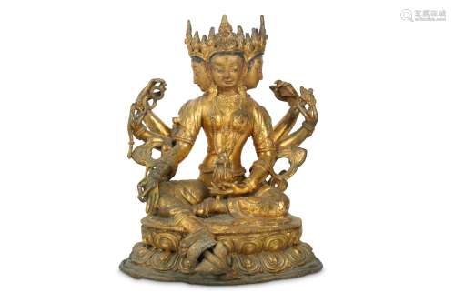 A CHINESE GILT-BRONZE SEATED FIGURE OF THREE-FACED VASUDHARA.