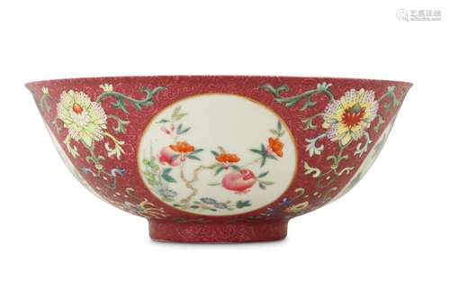 A CHINESE FAMILLE ROSE RUBY-GROUND SGRAFFITO MEDALLION BOWL.