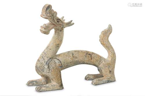 A CHINESE POTTERY FIGURE OF A DRAGON.