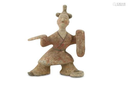 A CHINESE POTTERY FIGURE OF A DANCER.