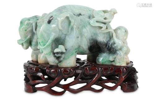 A CHINESE APPLE-GREEN JADEITE 'ELEPHANTS AND A BOYS' GROUP.